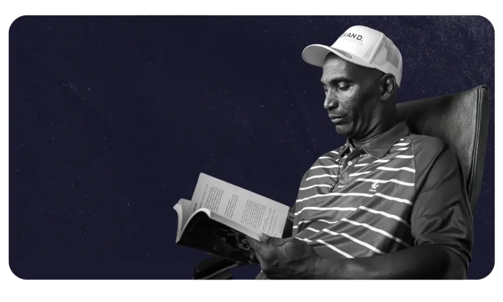 Author Ryan D. Patterson Sr. reading a book, representing his journey of creating spiritually charged suspense novels